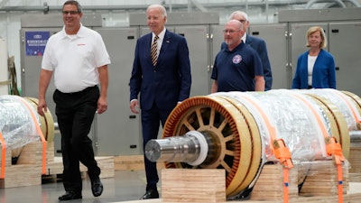 President Joe Biden and Mark Obradovich, Managing Director, Ingeteam, Inc., left, and others arrive at Ingeteteam Inc., in Milwaukee, Tuesday, Aug. 15, 2023.