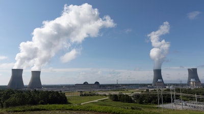 Nuclear reactors and cooling towers of the four units of Plant Vogtle, a nuclear plant near Waynesboro, Ga., are shown on July 31, 2023.
