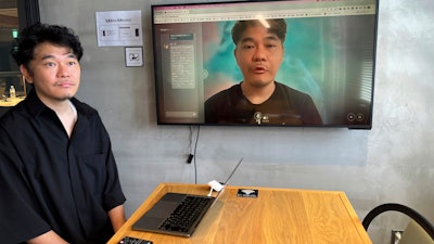 Kazutaka Yonekura, chief executive of Tokyo startup Alt Inc., demonstrates his digital clone on a personal computer at his office in Tokyo, Aug. 17, 2023. His company is developing a digital double, an animated image that looks and talks just like its owner.