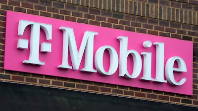 The sign for a T-Mobile store is seen, Jan. 30, 2023, in Pittsburgh.