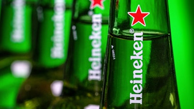 Bottles of Heineken beer are photographed in Washington, USA, March 30, 2018.