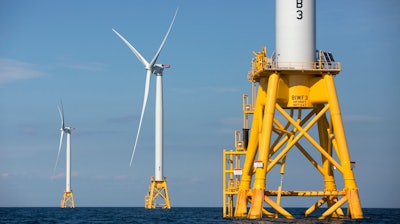 Three wind turbines stand in the water off Block Island, R.I, the nation's first offshore wind farm, Aug. 15, 2016.