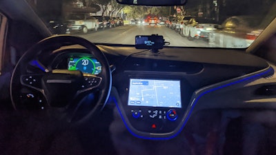 The empty driver's seat is shown in a driverless Chevy Bolt car named Peaches carrying Associated Press reporter Michael Liedtke during a ride in San Francisco, Sept. 13, 2022.