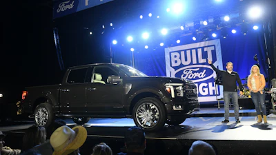 John Emmert, General Manager, North America, Trucks, talks about the 2024 Ford F-150 reveal at the F-150 Fest at Hart Plaza in Detroit on Tuesday, Sept. 12, 2023. Emcee Cristy Lee is at right.