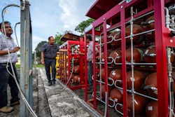P V R Murthy, center, general manager at Oil India Limited, pump station 3, shows a part of a hydrogen plant in Jorhat, India, Thursday, Aug. 17, 2023.