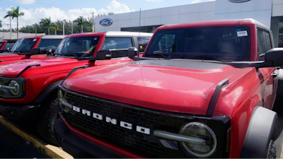 Ford Broncos line the front of Gus Machado's Ford dealership on Jan. 23, 2023, in Hialeah, Fla.