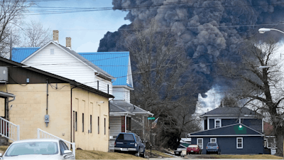 A black plume rises over East Palestine, Ohio, as a result of a controlled detonation of a portion of the derailed Norfolk Southern trains, Feb. 6, 2023.