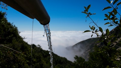 Spring water flows from a BlueTriton pipe in the San Bernardino National Forest on Monday, Sept. 18, 2023, in San Bernardino, Calif.