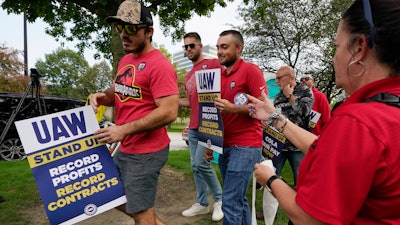 United Auto Workers march outside the Stellantis North American Headquarters, Wednesday, Sept. 20, 2023, in Auburn Hills, Mich.