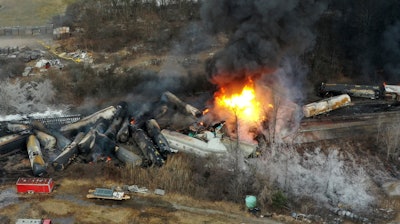 This photo taken with a drone shows portions of a Norfolk Southern freight train that derailed the night before in East Palestine, Ohio, still on fire at mid-day on Feb. 4, 2023.