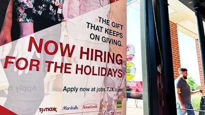 A hiring sign is displayed at a retail store in Vernon Hills, Ill., Thursday, Aug. 31, 2023.
