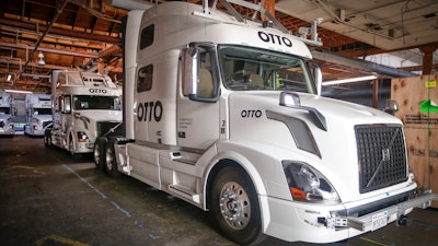 Otto's self-driving, big-rig trucks are lined up during a demonstration at the Otto headquarters on Aug. 18, 2016, in San Francisco.