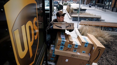 A UPS driver prepares to deliver packages in Baltimore, Md., Dec. 19, 2018.