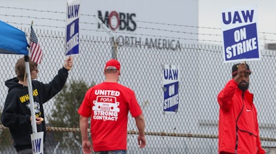 United Auto Workers union members strike for improved compensation outside of the Stellantis Toledo Assembly Complex on Thursday, Sept. 28, 2023 in Toledo, Ohio.
