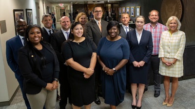 ​​NTSB Chair Jennifer Homendy (right) with some of the 15 new employees sworn in this week. The agency now has 433 staffers.