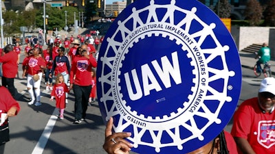 United Auto Workers members walk in the Labor Day parade in Detroit, Sept. 2, 2019.