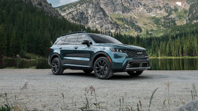 This photo provided by Kia shows the 2023 Sorento. It is a bit bigger than the typical small SUV and has a third-row seat that will come in handy for growing families.
