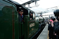 The Flying Scotsman, a historical locomotive, arrives at Kings Cross railway station in London to pick up passengers for its journey to York, Thursday, Feb. 25, 2016.