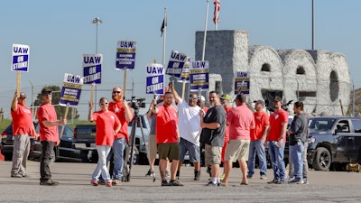 United Auto Workers union members strike outside the Chrysler Toledo Assembly Plant in Toledo, Ohio on Tuesday, Oct. 3, 2023.
