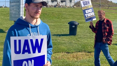 Logan Bohn, a member of the striking United Auto Workers, stands outside the Stellantis plant that makes Jeeps in Toledo, Ohio, on Friday, September 15, 2023. Bohn is a temporary worker at the plant.