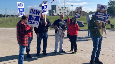 Striking United Auto Workers picket outside the Stellantis plant that makes Jeeps in Toledo, Ohio, on Friday, September 15, 2023.