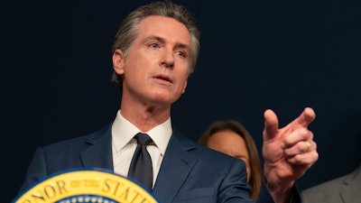California Gov. Gavin Newsom answers questions during a news conference in Sacramento, Calif., Sept, 26, 2023. Newsom signed several laws on Wednesday, Oct. 4, 2023, including one that increases paid sick days for workers and another that limits when local governments can count votes by hand.