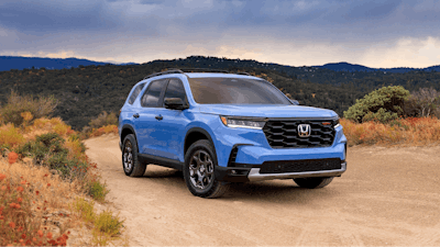 This photo provided by Honda shows the 2024 Pilot three-row SUV. Its distinctive TrailSport trim has a raised stance and all-terrain tires to enhance off-road capability.