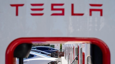 Tesla vehicles charge at a station in Emeryville, Calif., Wednesday, Aug. 10, 2022.