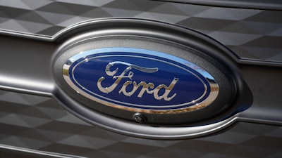 The Ford company logo is shown on Thursday, Nov. 25, 2022, outside a Ford dealership in southeast Denver.