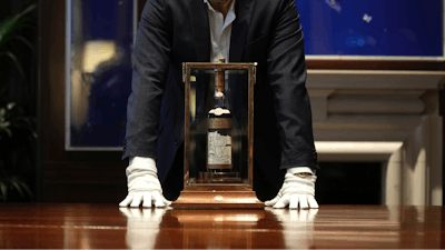 A bottle of the world's most valuable whisky is on display during a media preview of Sotheby's auction, in London, Thursday, Oct. 19, 2023.