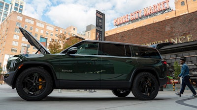 A Rivian R1S is displayed outside of the auto manufacturer's new space at Ponce City Market on Thursday, Oct. 19, 2023 in Atlanta.