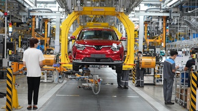 Workers assemble a car at a Vinfast factory in Hai Phong, Vietnam, on Sept. 29, 2023.