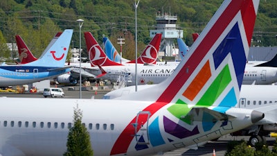 Boeing 737 Max airplanes sit parked in a storage lot, Monday, April 26, 2021, near Boeing Field in Seattle. Boeing reports earnings on Wednesday, Oct. 25, 2023.