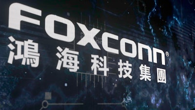 The Foxconn logo is seen during the Hon Hai Tech Day at the Nangang Exhibition Center in Taipei, Taiwan, on Oct. 18, 2022.