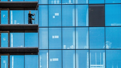 A construction worker on a high-rise residential building in Arlington, Va., Oct. 16, 2023.
