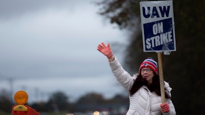 General Motors' Spring Hill union employee Mary Beth Gervais walks the picket line near the plant in Spring Hill, Tenn., Monday, Oct. 30, 2023.