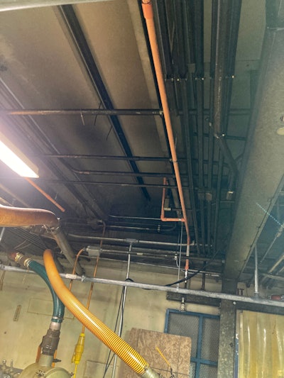 A VESDA system like that from Honeywell will determine when smoke contamination from a fire exceeds the atmospheric reference and then activate the building’s fire alarm.