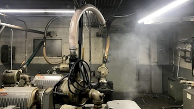 The challenge is to quickly and accurately distinguish between smoke from an actual fire and the typical background airborne particulates during meat processing.