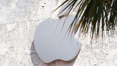 The Apple logo is displayed over their store, Sept. 19, 2023, in Miami Beach, Fla.