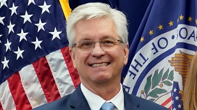 Federal Reserve Board of Governors member Christopher Waller poses for a photo on May 23, 2022, in Washington. Waller said Tuesday, Nov. 28, 2023 that the U.S. economy is cooling and inflation is steadily slowing, suggesting that the Fed's interest rate policies are succeeding in getting price increases back to the central bank's 2%.