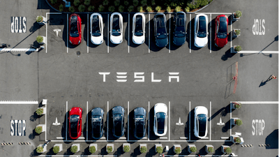 Tesla vehicles line a parking lot at the company's Fremont, Calif., factory, on Sept. 18, 2023.