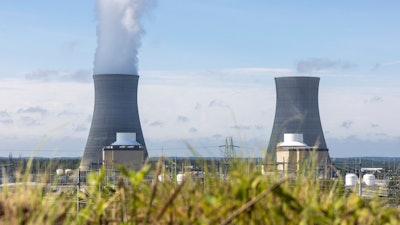 The first of two new nuclear reactors, left, operates at Plant Vogtle, July 31, 2023, in Burke County near Waynesboro, Ga., while the second reactor, right, awaits completion.