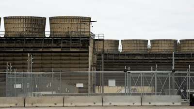 Cooling towers release heat generated by boiling water reactors at Xcel Energy's Nuclear Generating Plant, Oct. 2, 2019, in Monticello, Minn.