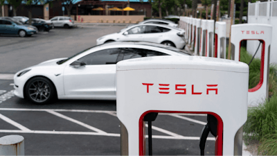 Tesla electric vehicles are charged at a charging station in Anaheim, Calif., June 9, 2023.