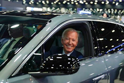 President Joe Biden drives a Cadillac Lyriq through the show room during a tour at the Detroit Auto Show, Sept. 14, 2022, in Detroit. The Biden administration has proposed new rules that could make it harder for electric vehicles to qualify for a full $7,500 federal tax credit. The rules announced Dec. 1 could complicate efforts to meet President Joe Biden's goal that half of new passenger vehicles sold in the U.S. run on electricity by 2030.