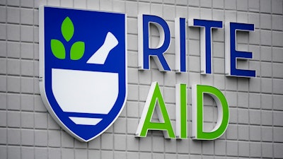 A Rite Aid sign is displayed on the facade of a store in Pittsburgh, Jan. 23, 2023. Rite Aid has been banned from using facial recognition technology for five years over allegations that a surveillance system it used incorrectly identified potential shoplifters, especially Black, Latino, Asian or female shoppers. The deal announced late Tuesday, Dec. 19, settles Federal Trade Commission charges that the struggling drugstore chain didn’t do enough to prevent harm to its customers and implement “reasonable procedures,” the government agency said.
