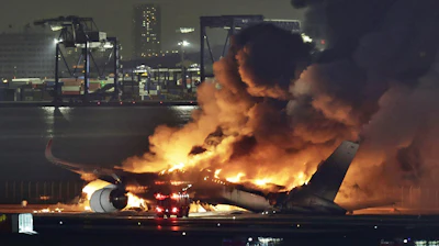 A Japan Airlines plane is on fire on the runway of Haneda airport on Tuesday, Jan. 2, 2024 in Tokyo, Japan.