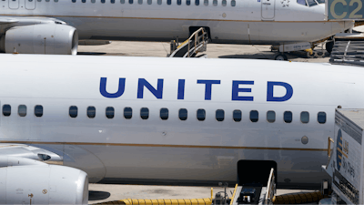 Two United Airlines Boeing 737s are parked at the gate at the Fort Lauderdale-Hollywood International Airport in Fort Lauderdale, Fla., on July 7, 2022.