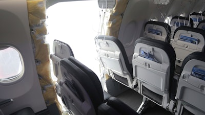 This image taken Sunday, Jan. 7, 2024, and released by the National Transportation Safety Board, shows a section of Alaska Airlines Flight 1282 that is missing panel on a Boeing 737-9 MAX in Portland, Ore.