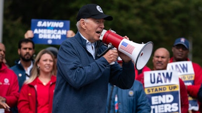 President Joe Biden speaks to striking United Auto Workers on the picket line outside the Willow Run Redistribution Center, UAW Local 174, Sept. 26, 2023, in Van Buren Township, Mich.